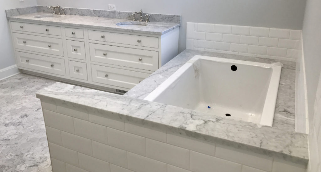 Glen Lake Residence | Carrara White Honed Marble Master Bath