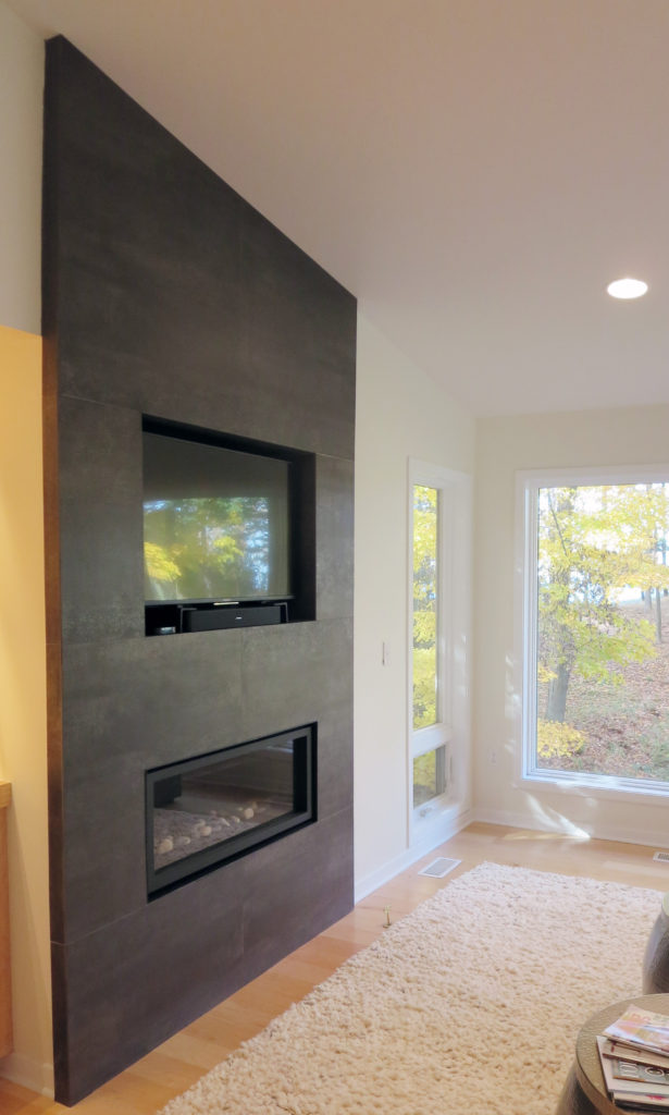 North Muskegon Residence | Iron Grey 4' x 4' NeoLith Tile Living Room Fireplace Surround